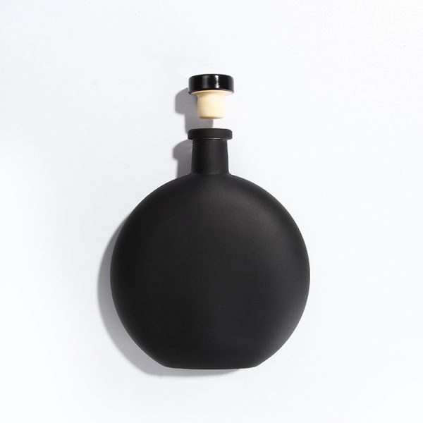 black disc bottle with cork