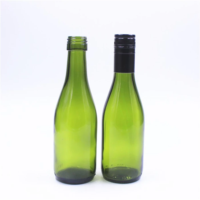 Two 187ml green glass bottles on a white background—one without a cap and one with a black cap