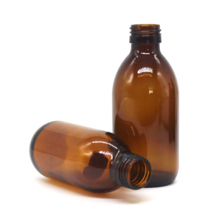 Empty amber glass syrup bottle