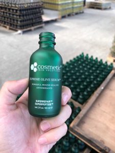 green frosted essential oil bottle with printing