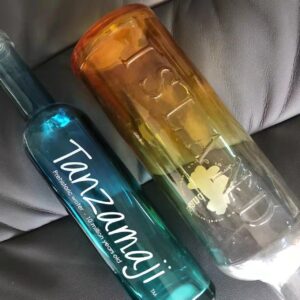 custom liquor bottle with vertical embossed logo