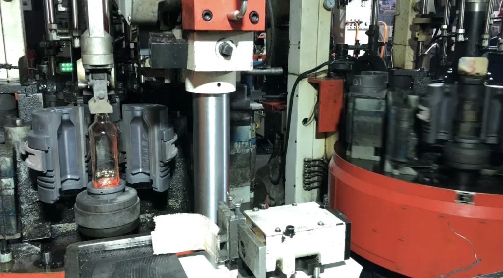 Glass bottle forming with molds on IS machine