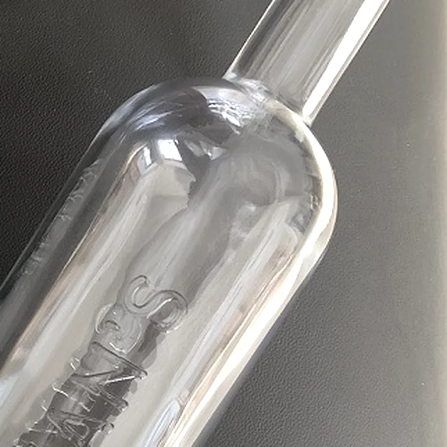 Custom glass bottle sample with embossed lettering detail