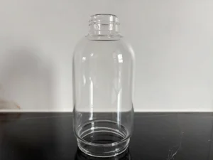 Clear borosilicate glass body with a narrow threaded top opening and a wider threaded bottom opening